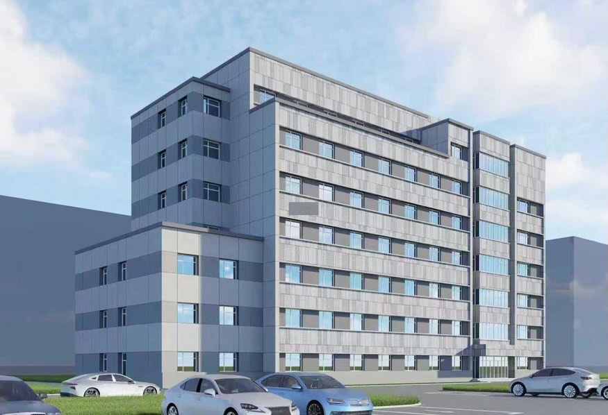 Edificio moderno de varias plantas con fachada gris y ventanas alineadas.